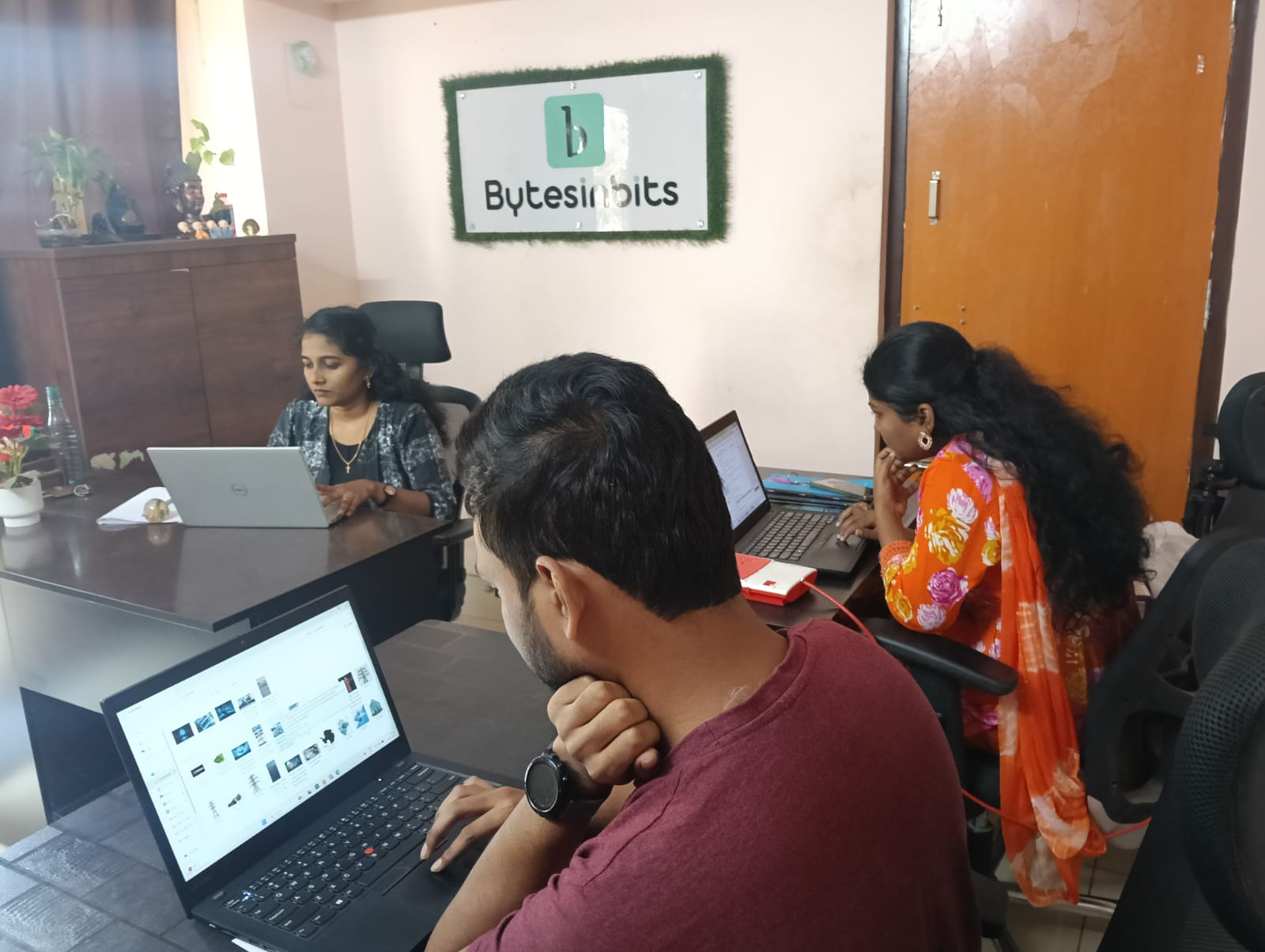 Bytes in Bits office with the team working